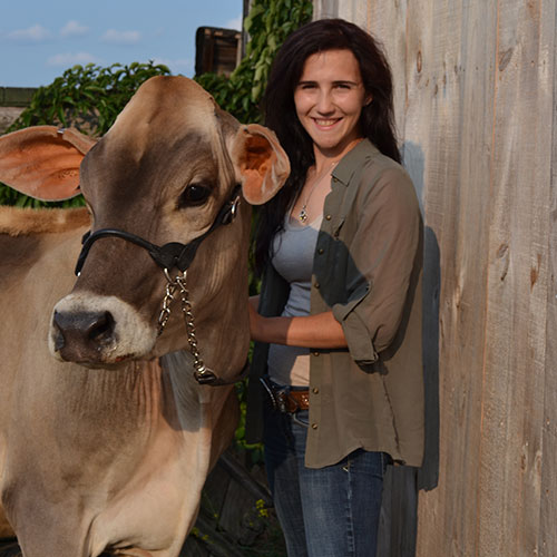 Carrie Shuman with a cow