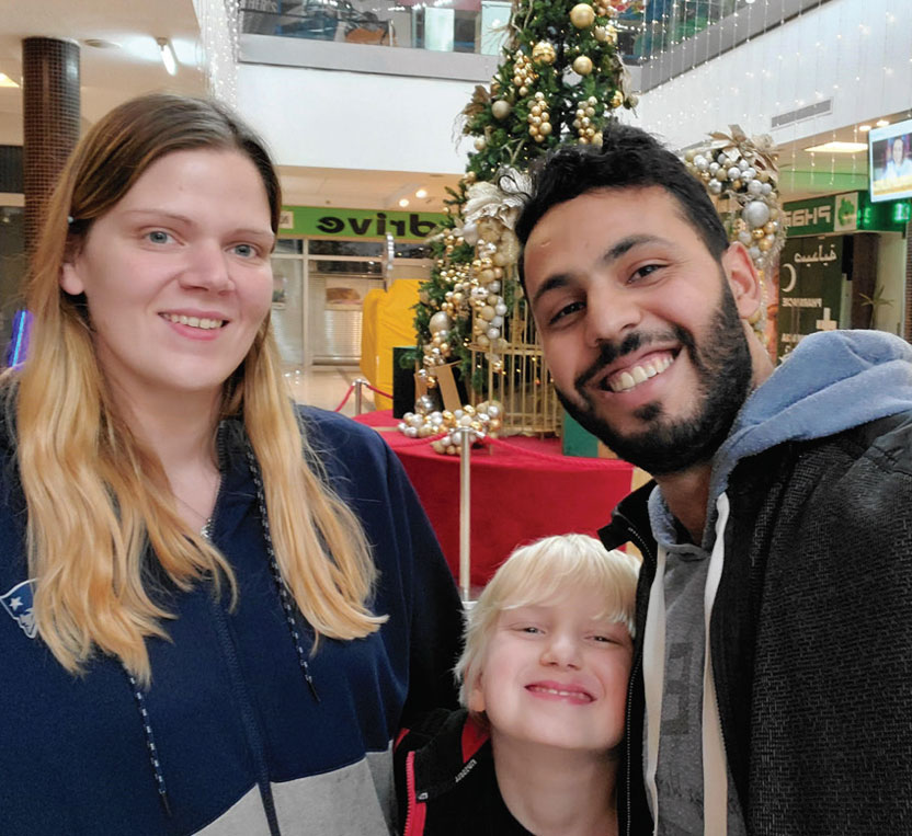 Posing from left: Jessica Miller, her son Owen, and Mouaad Essaadi.