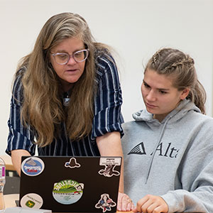 Sheila Marshman works with dairy science student Cara Walker.