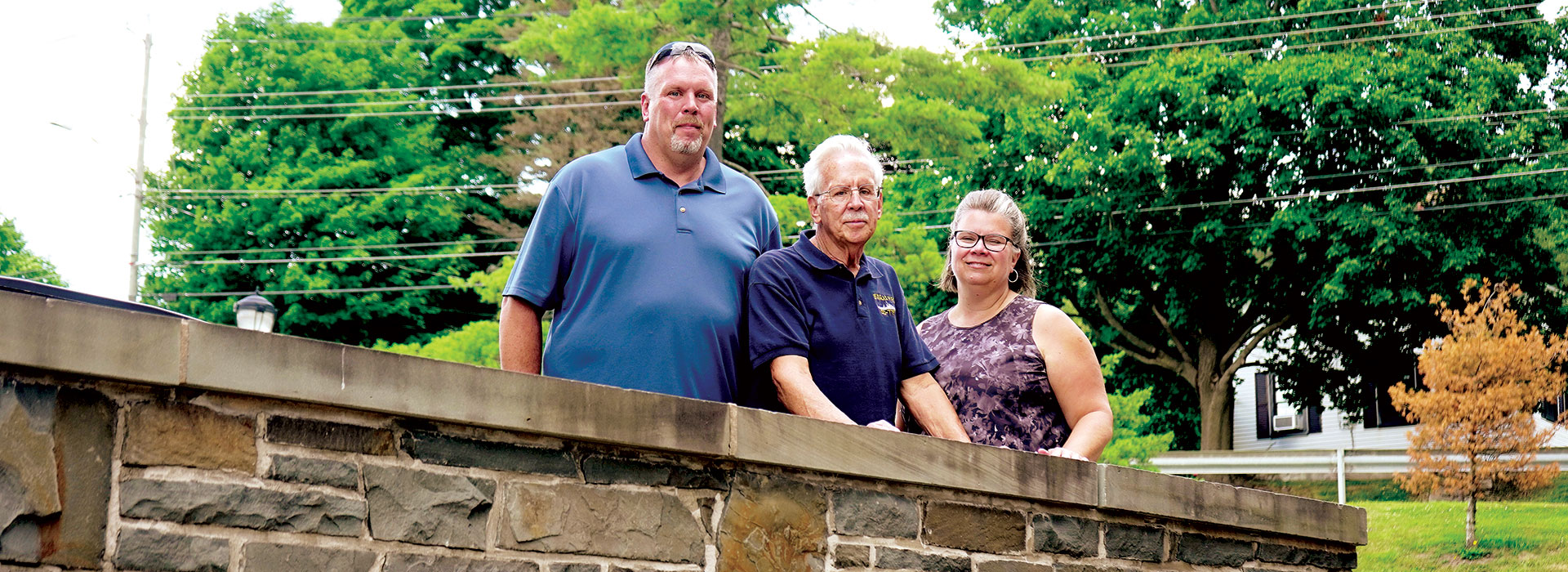 George (center) with his son, Jason, and daughter, Trudi. 