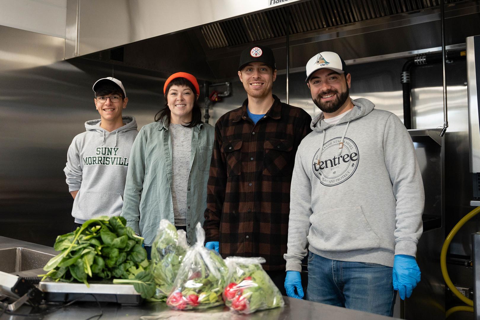 From left: Gareth March, Kate Bolen, Jim Sayles and Justin Redivivo pose in the new Four Seasons Farm facility.