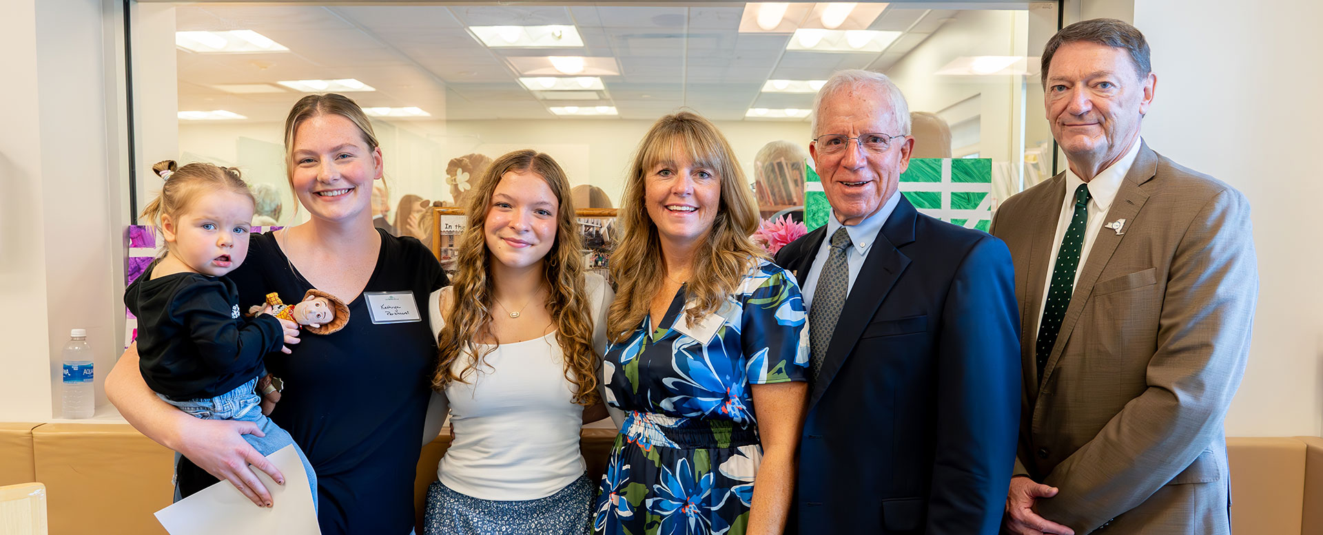 From left: Kathryn Merkle, holding daughter, Vivian; Polly LePage; Jennifer Britton; former SUNY Morrisville President Frederick Woodward; and SUNY Morrisville President David Rogers.