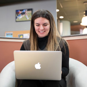 Student studies on a laptop