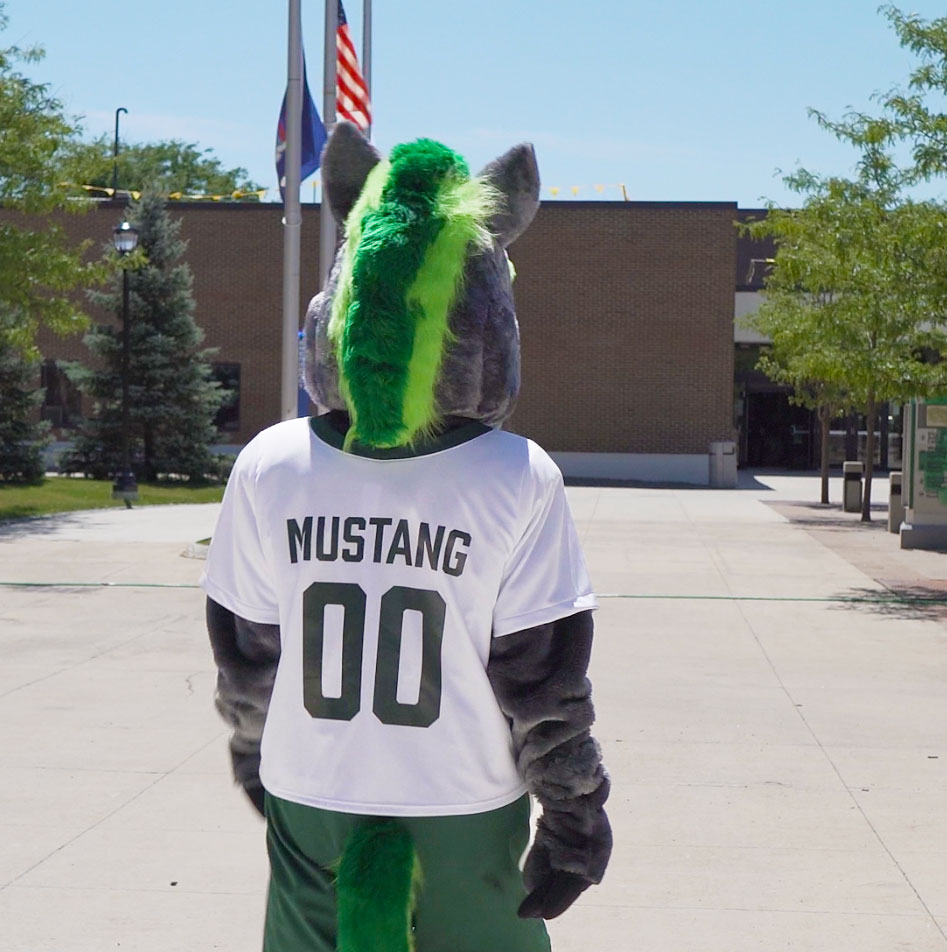 SUNY Morrisville Mascot Mo walks through the Admin Quad