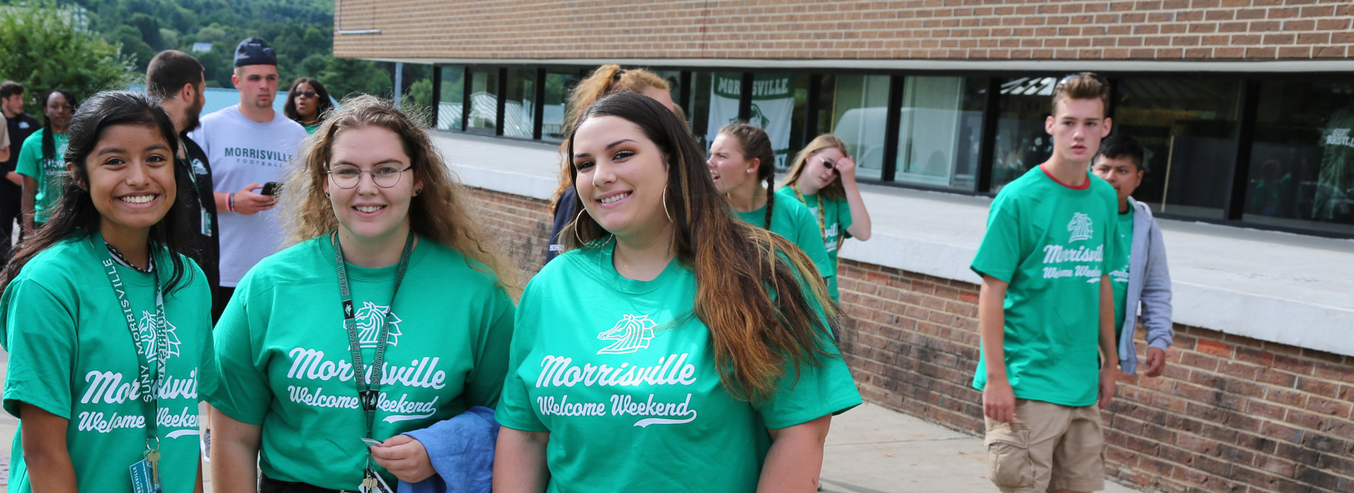 3 future students posing on the sidewalk