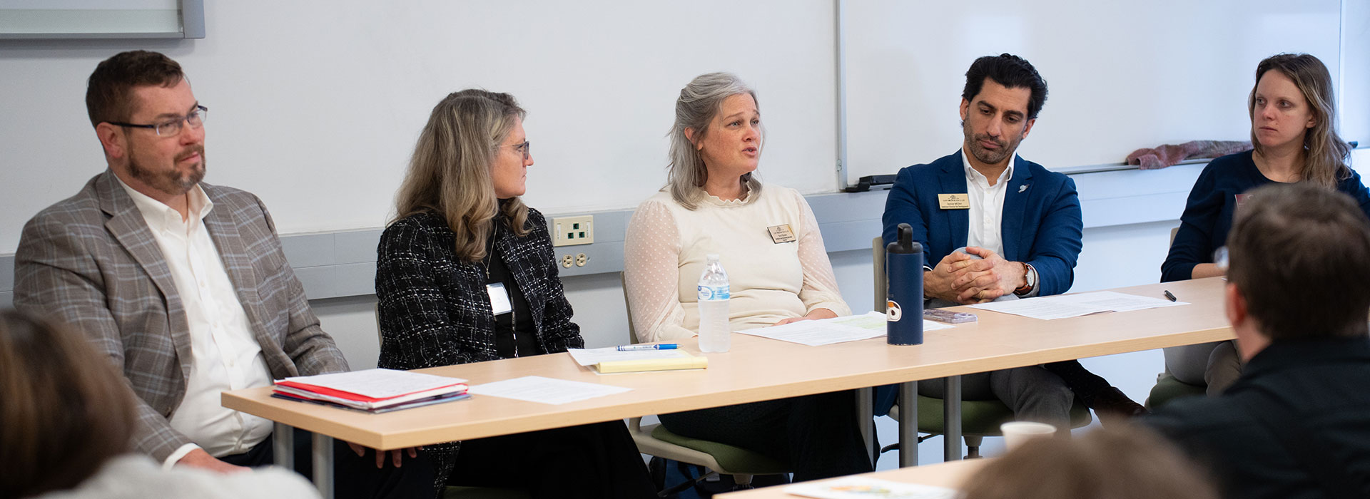 Faculty and staff participate in a panel on the SUNY Morrisville campus.