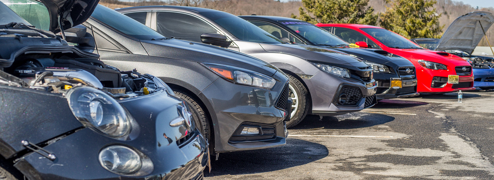 Row of cars ready for the car show; Photo credit: Impavidus Studios Photography