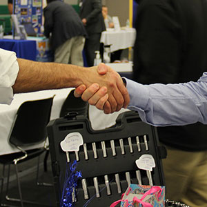 Shaking hands at a career fair.