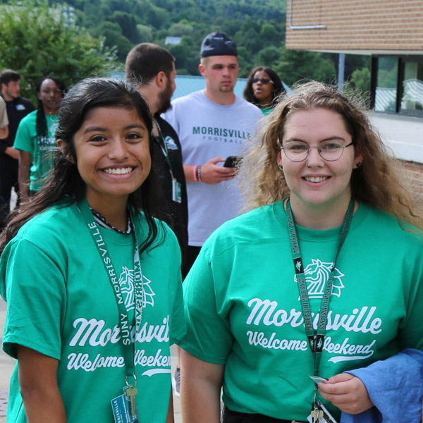 2 future students posing on a sidewalk
