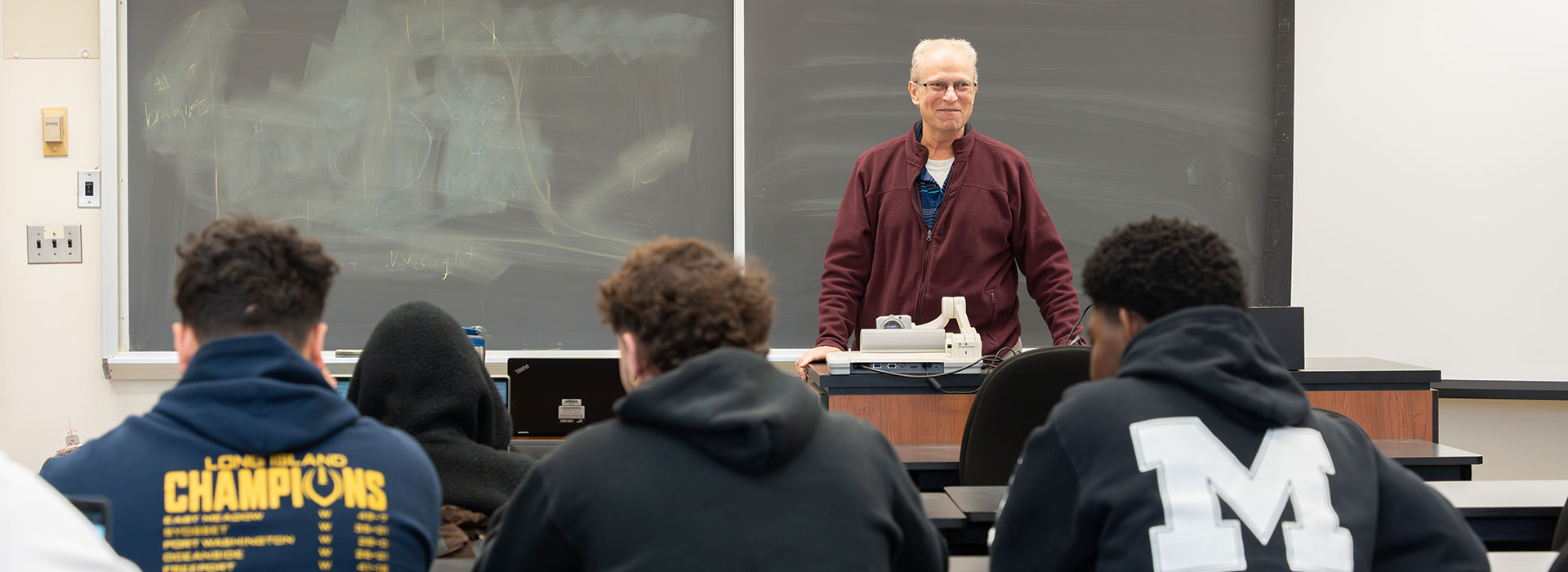 Christopher Scalzo, professor of business at SUNY Morrisville, teaches in his Morrisville classroom.