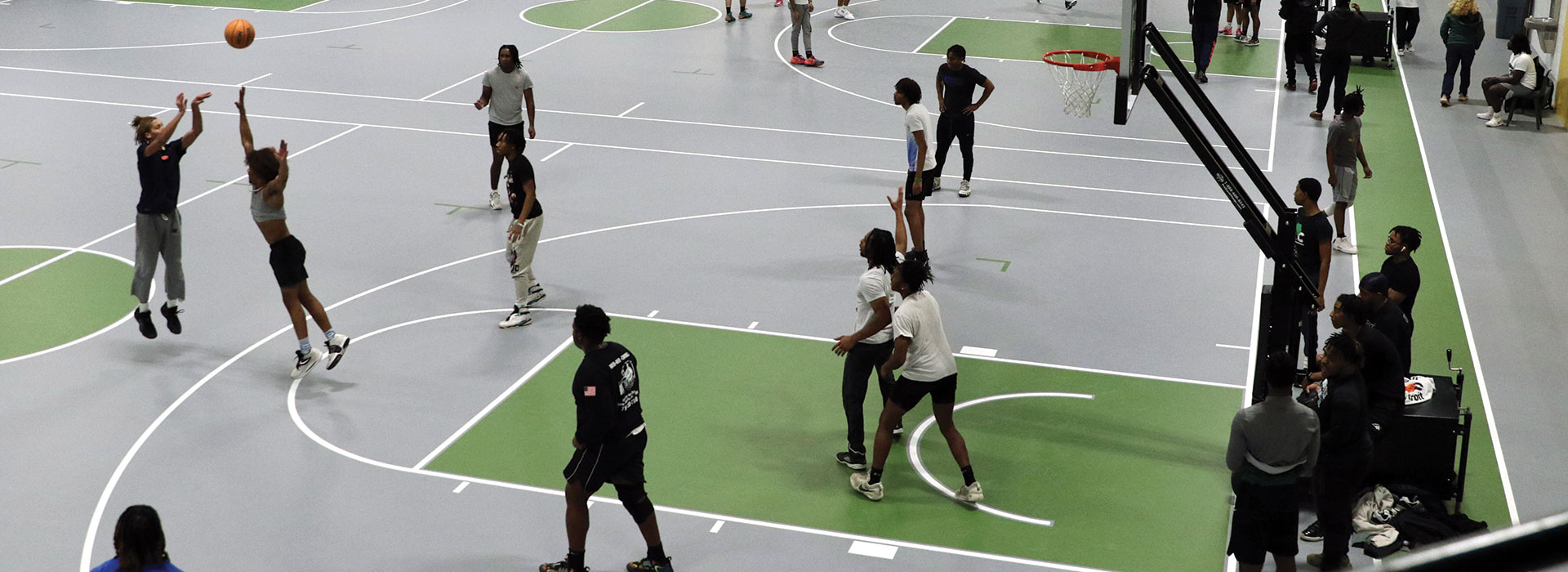 Students play basketball in the new student recreation center.