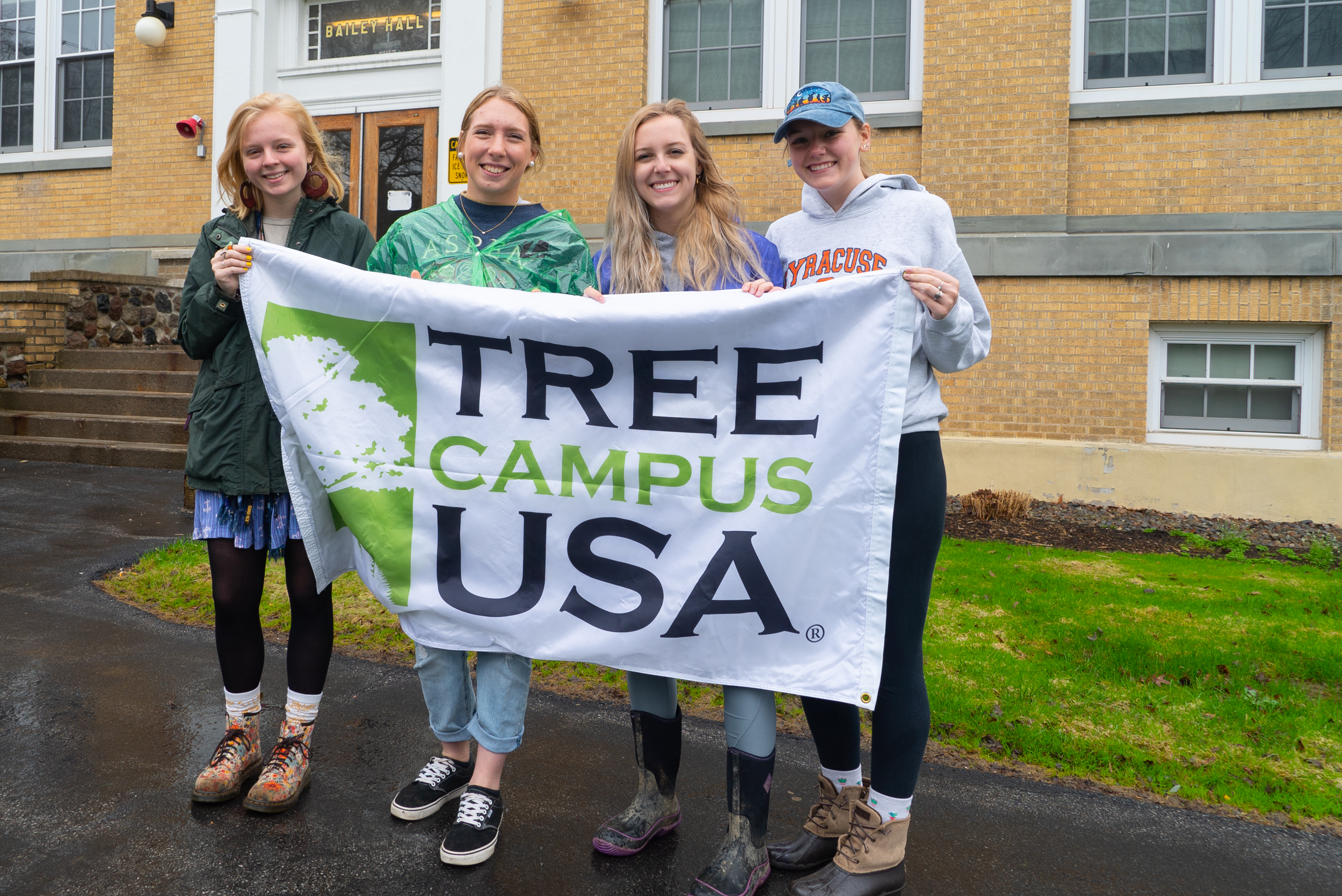 Students celebrate receiving a prior Tree Campus USA® recognition by the Arbor Day Foundation.