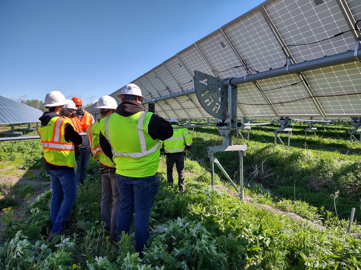 Students engage with a single-axis solar tracking system.