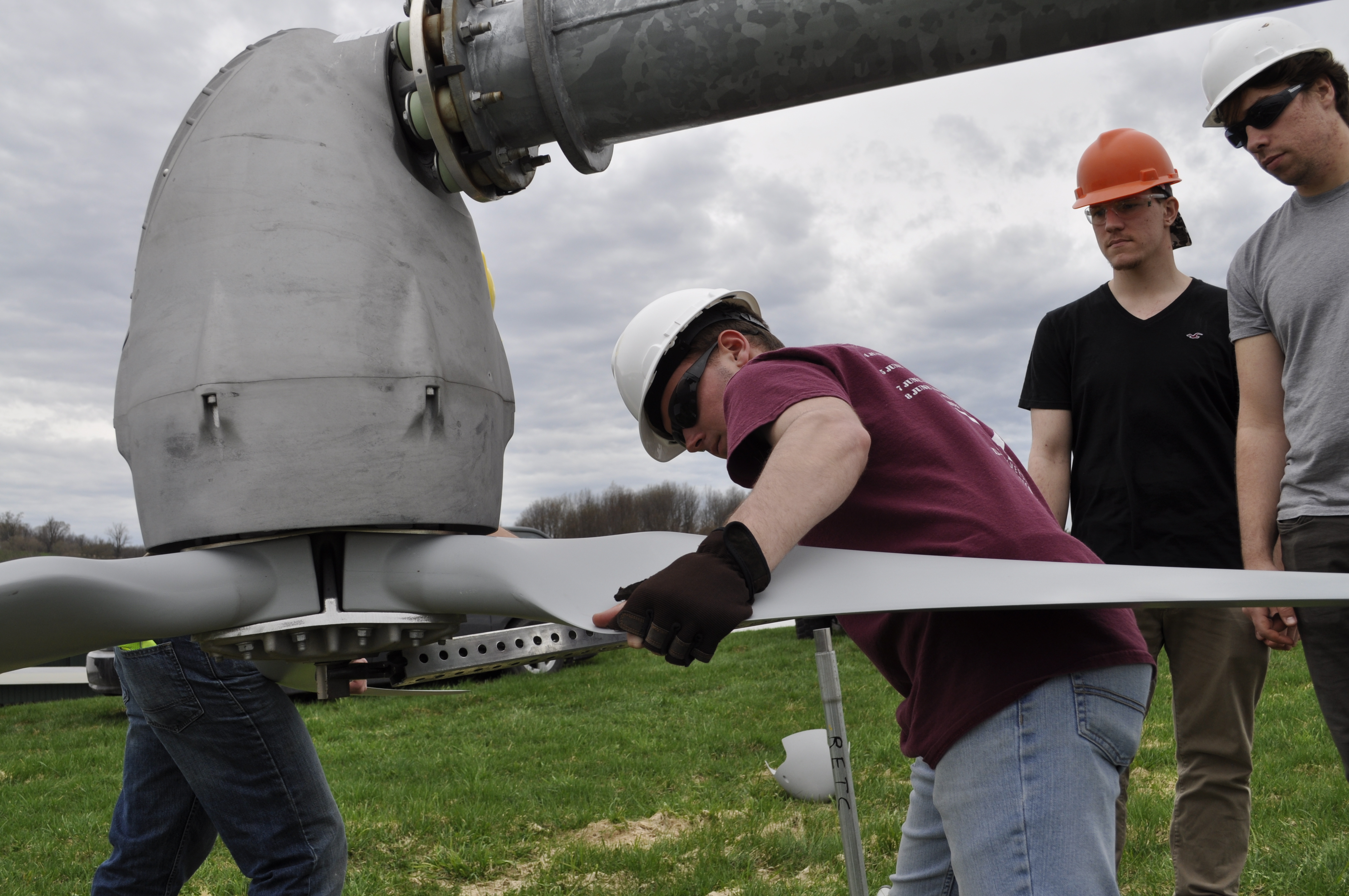 Students work on the college's wind turbine