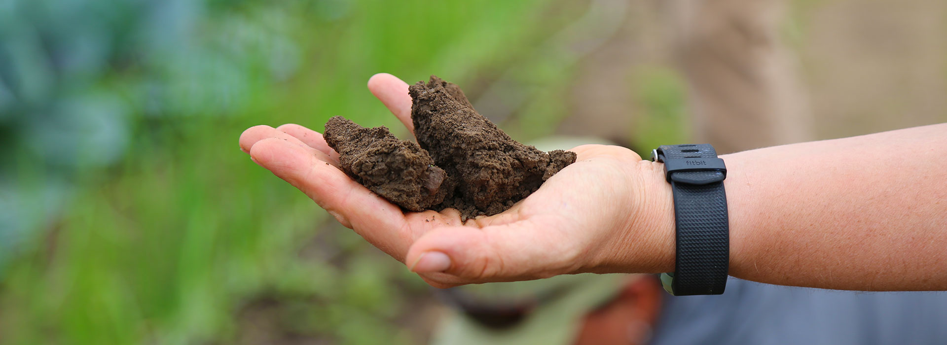 Agricultural Science Professor Jen Gilbert Jenkins holds a handful of soil as she teaches about soil sampling