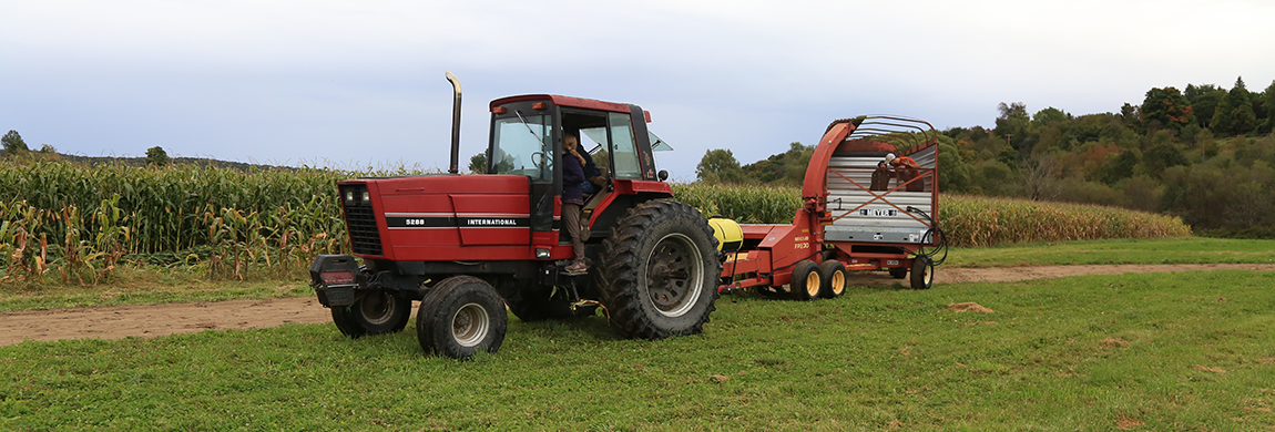 Student driving a tractor