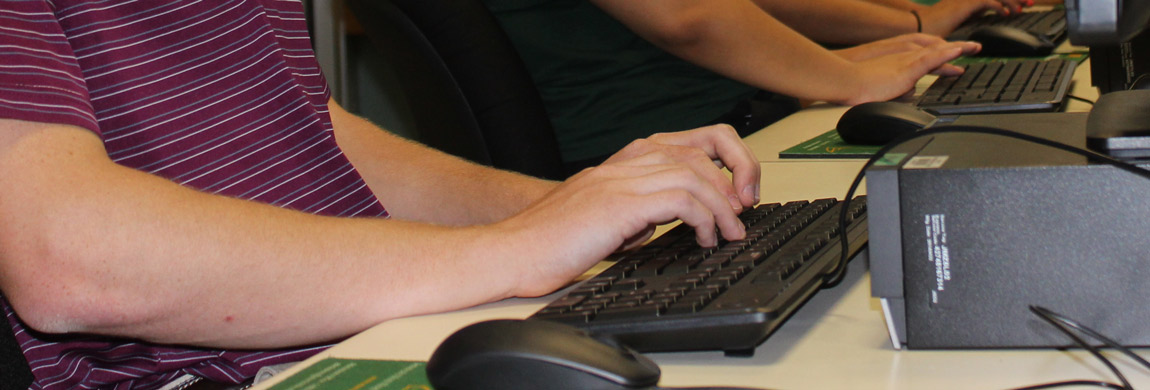 hands typing on keyboard