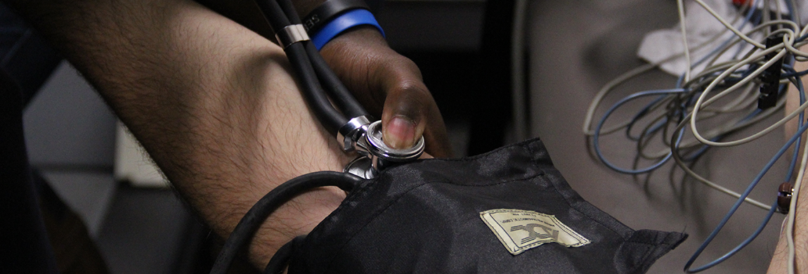 Student taking blood pressure