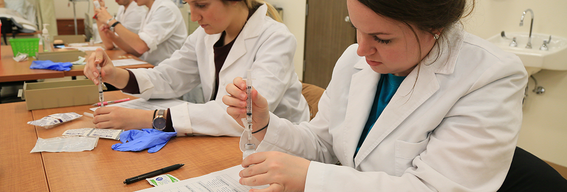 Nursing students learning about dosage