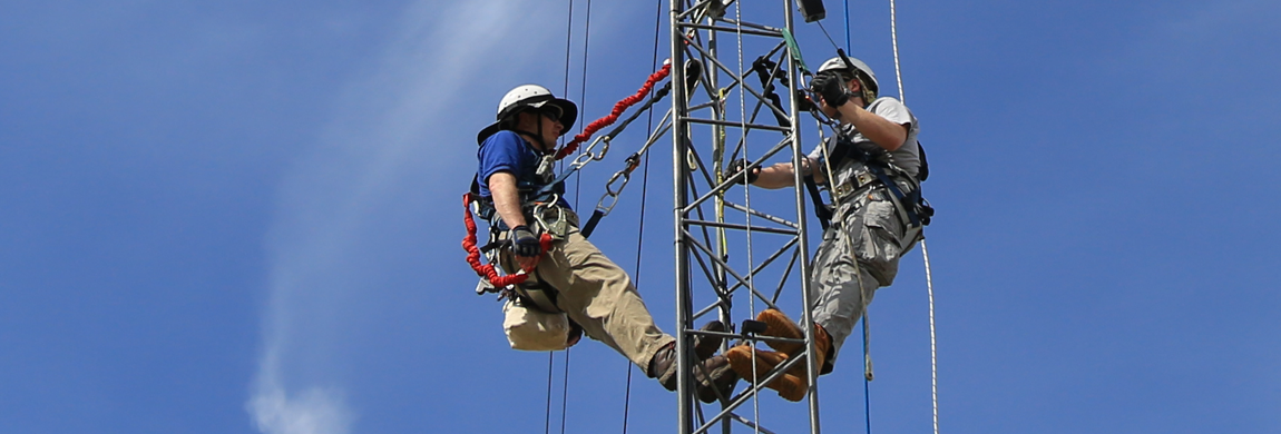 Students climbing an electrical thing