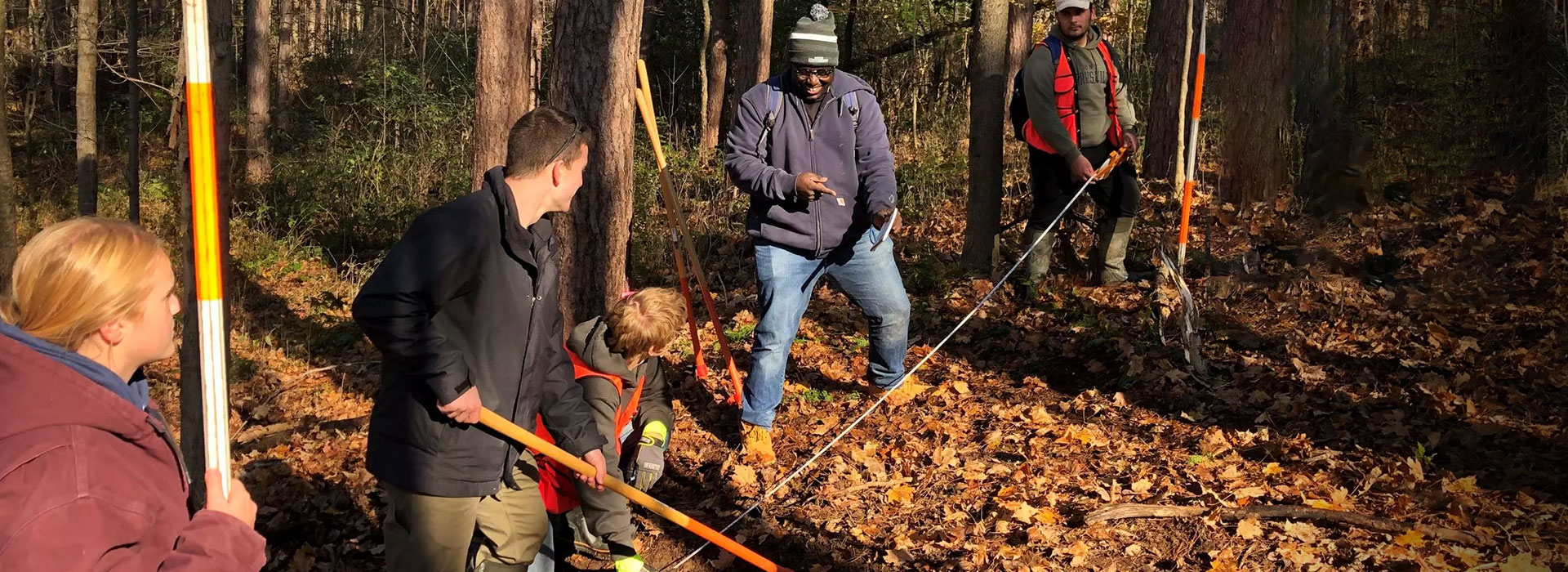 Students laying out a water bar