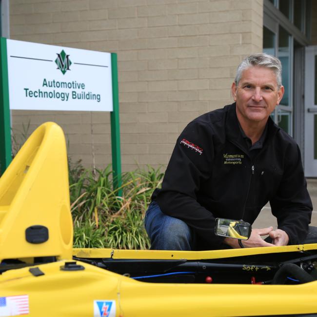 Phil Picard poses with his vehicle