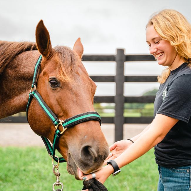Finn and equine student Victoria Epstein share a bonding moment