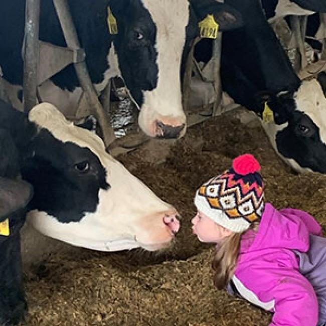Brynley Bossard puckers up for Buttercup.
