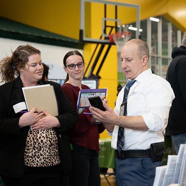 Students work with an employer at the Job & Internship Fair.