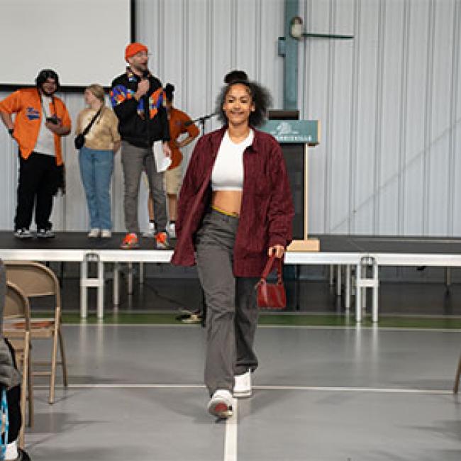 Students participate in a fashion show on campus