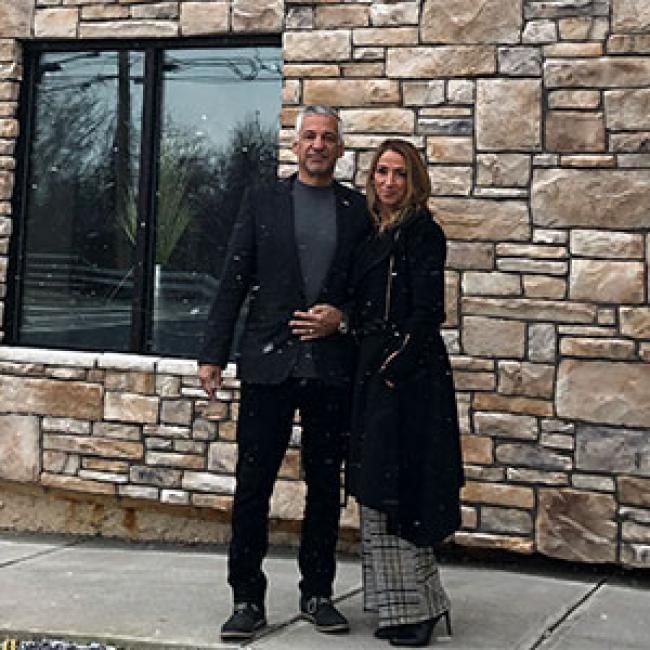 Len and Regina Montreal pose in front of The Preserve at 405