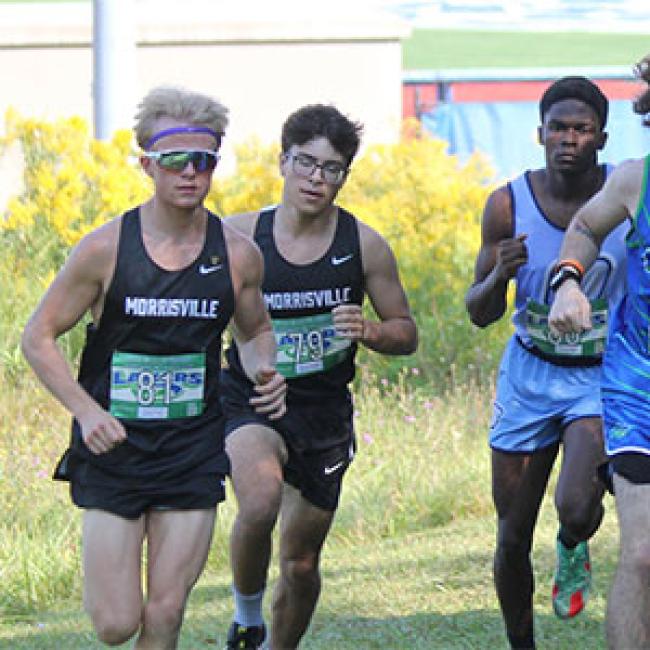 Nikko Recchio, left, competes in a cross-country race.