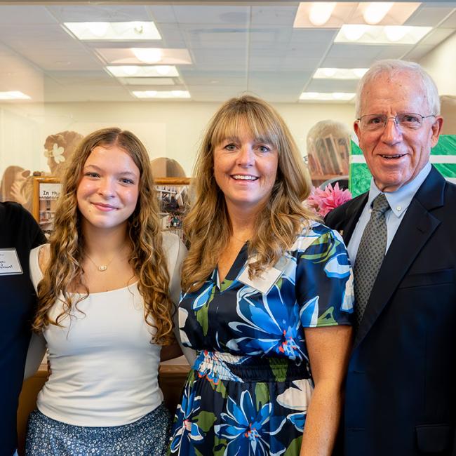 From left: Kathryn Merkle, holding daughter, Vivian; Polly LePage; Jennifer Britton; former SUNY Morrisville President Frederick Woodward; and SUNY Morrisville President David Rogers.