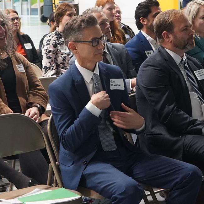 Faculty, staff and community members attend a past advisory board event.