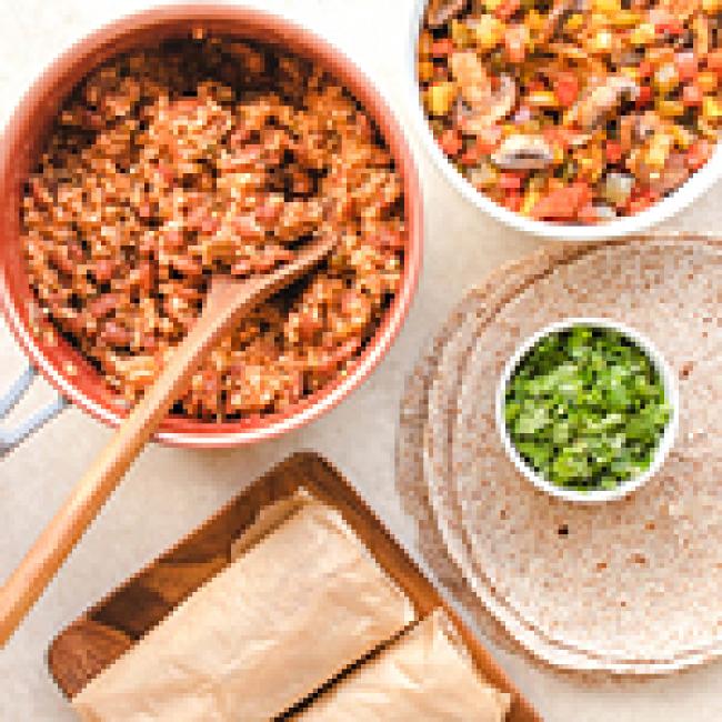 Brown rice, tortillas, and other ingredients to build a burrito in bowls