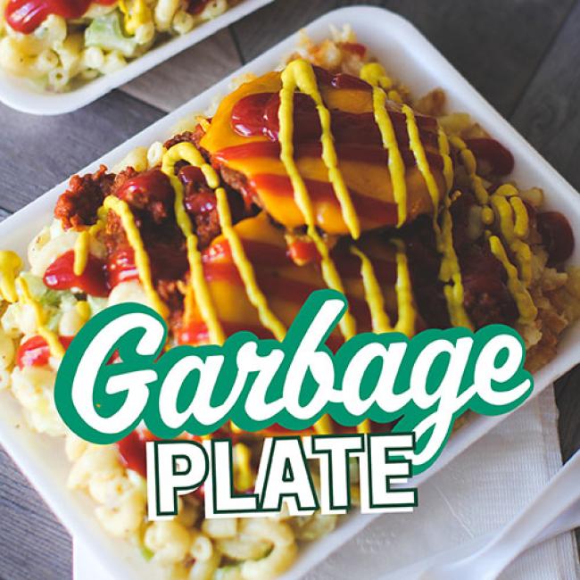 Garbage plate with macaroni salad, chicken breast, ketchup, mustard, and more