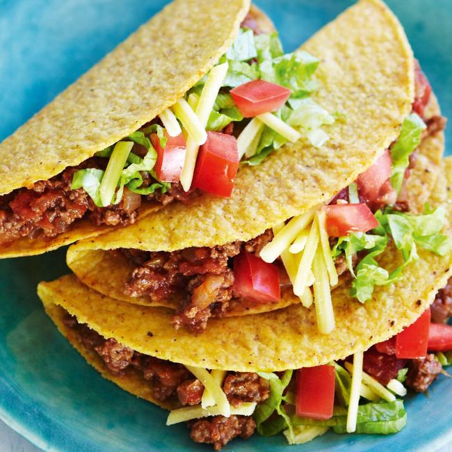 3 beef tacos on a blue plate