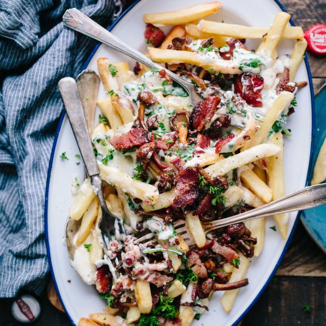 French fries covered in cheese and bacon