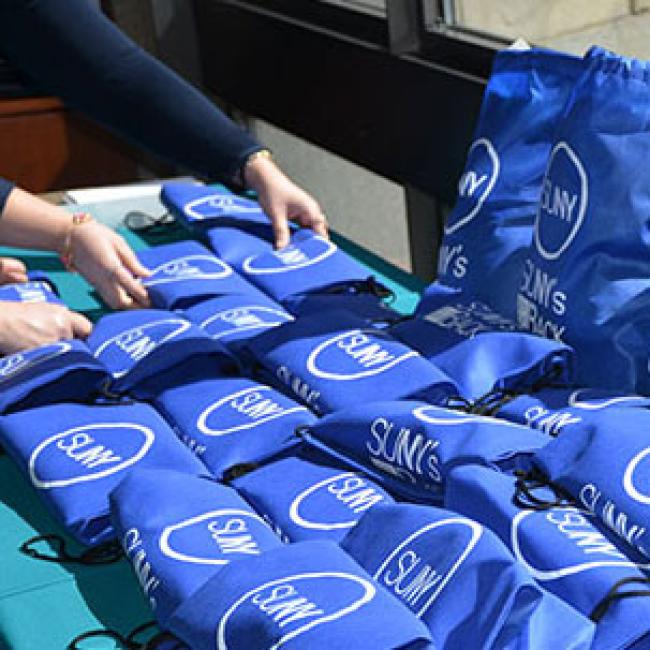 Table full of packed SUNY's Got your Back bags