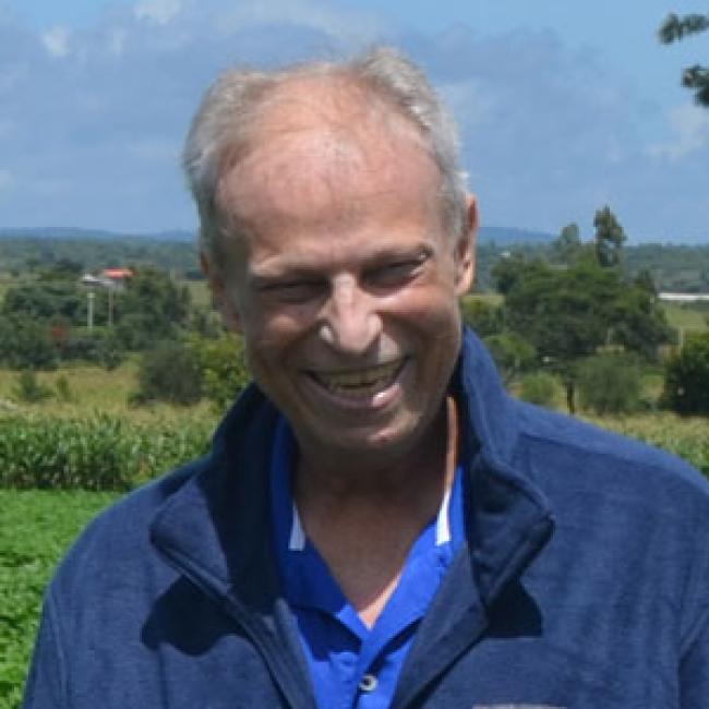 Chris Scalzo smiling in a field.