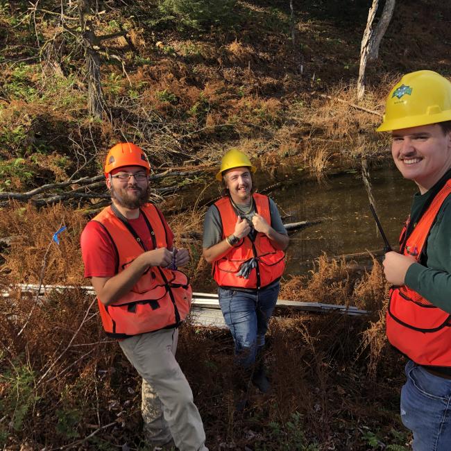 SUNY Morrisville Conservation Tri-Society (CTS) club members take a break while performing service activities at Camp Kingsley for the Leatherstocking Council’s scouting programs. 