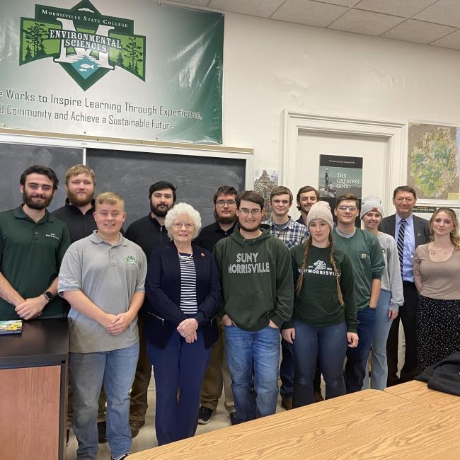 Students pose with Norma Galbreath, President Rogers and faculty, staff and guests