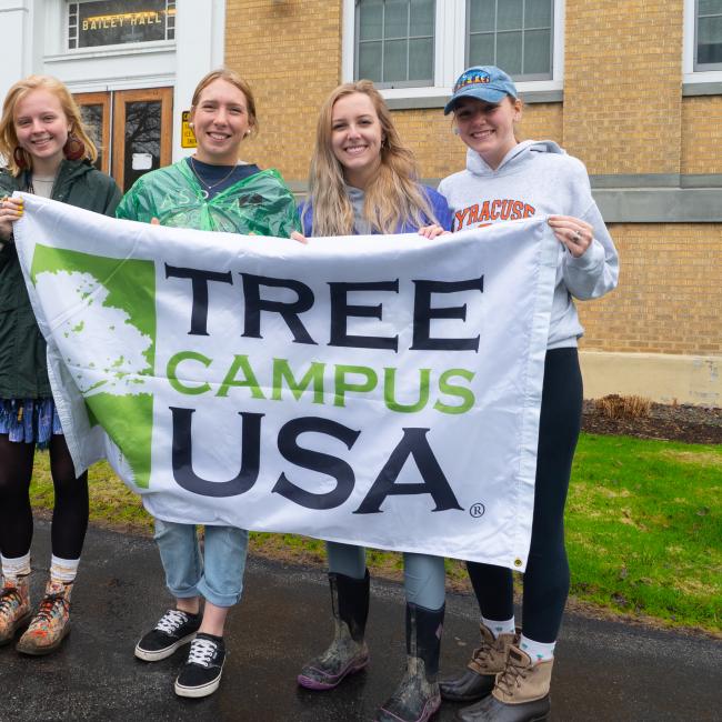Students celebrate receiving a prior Tree Campus USA® recognition by the Arbor Day Foundation.