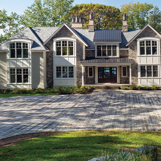 The workmanship of Lasnicki’s landscaping and hardscaping gleams in this home on Skaneateles Lake.