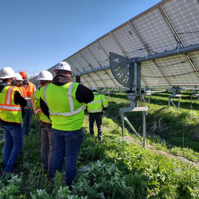 Students engage with a single-axis solar tracking system.