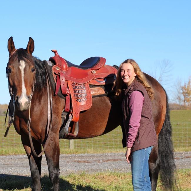 Pictured with her winning saddle is Victoria Epstein and “Lola,” the horse who carried her to her latest win.