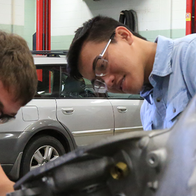 Students working on cars