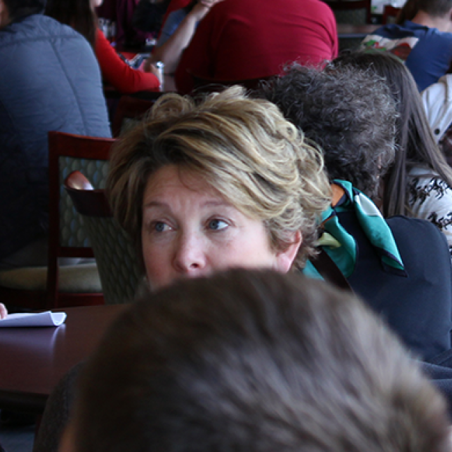 People sitting around tables