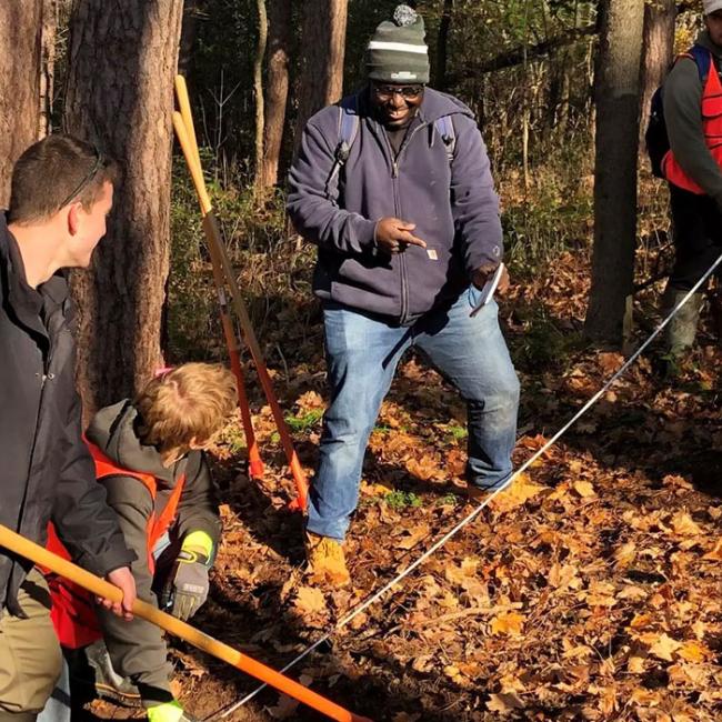 Students laying out a water bar