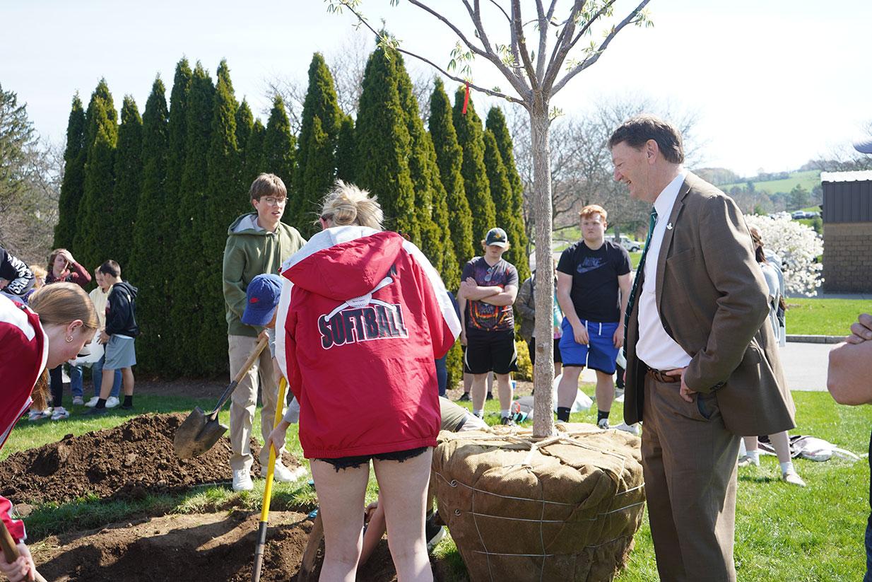SUNY Morrisville President David Rogers oversees tree planting on Earth Day.